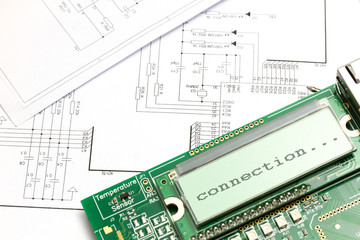 Electronic board with a display on the background of the circuit diagram