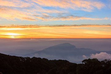 Beautiful Colorful Sunrise and Silhouette Mountain on the top of mountain in Thailand 
