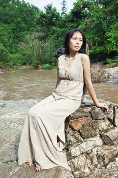 Asian woman in natur