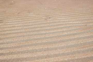 Ripple sand on the beach after low tide