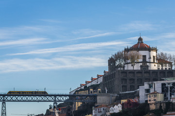 Dom Luis I bridge seen from Vila Nova de Gaia city, Portugal. View with Serra do Pilar monastery