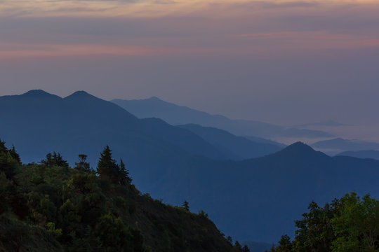 Beautiful Colorful Sunrise and Silhouette Mountain on the top of mountain in Thailand 

