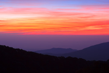 Beautiful Colorful Sunrise and Silhouette Mountain on the top of mountain in Thailand 
