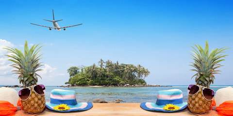 Wood floor with pineapple on tropical island and airplane,concept summer and travel background.