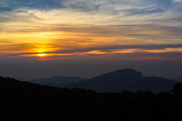 Beautiful Colorful Sunrise and Silhouette Mountain on the top of mountain in Thailand 
