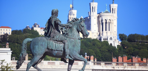 Obraz premium Famous statue of Louis XIV and Basilique of Notre Dame de Fourviere