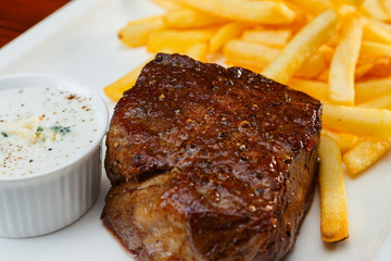 Rustic grilled beefsteak with french fries