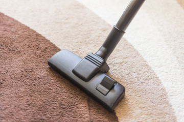 Cleaning the apartment with a vacuum cleaner