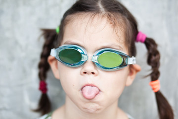 Little Asian Girl in swimming glasses