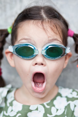 Little Asian Girl in swimming glasses