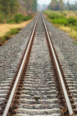 Fototapeta na wymiar railway tracks in a rural scene with