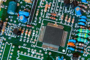 Close-up background of electronical board with accent on a chip