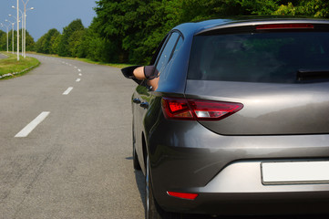 Fototapeta premium Car on asphalt road in nature