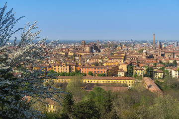 Fototapeta na wymiar Spring cityscape with Asinelli tower and San Petronio Cathedral, Bologna, Italy