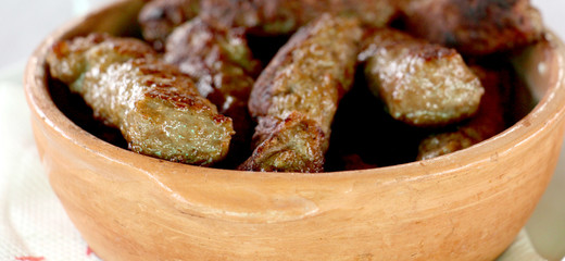 Grilled chicken on bamboo skewers, close up view