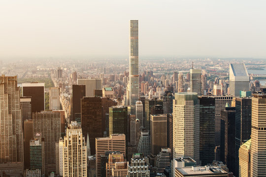 New York City Manhattan street aerial view with skyscrapers, pedestrian and busy traffic. View from Empire State Building