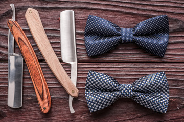 Vintage barber shop straight razor tool on wooden background