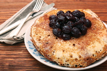 Delicious pancakes with cherry jam