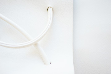 White leather and details of seams close-up. Things made of leather, texture and details of the product. 