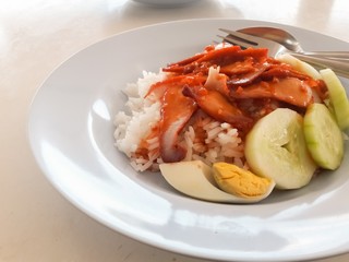 Barbecued red pork in sauce with rice