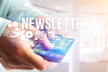 Concept of man holding futuristic interface with newsletter title and multimedia icons flying all around - Internet concept