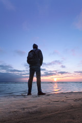 silhouette at sunrise on the beach / the bright dawn of early spring Ukraine