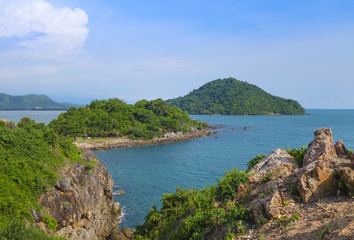 Beautiful aerial view point of tropical sea bay and island, with mountain cliff and rocks in foreground, Noen Nangphaya View Point at Chalerm Burapha Chonlathit Highway, Chanthaburi, Thailand.