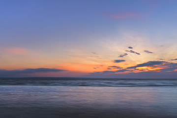 sunrise on the water / Early summer morning bright sky Beach