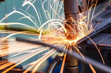Industrial, automotive spot welding, in a car factory with sparks, manufacturing, industry

