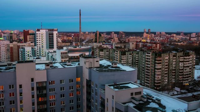 Ekaterinburg, Russia. Aerial view of downtown in Ekaterinburg, Russia at night. Beautiful sunset over the city. Time-lapse to complete darkness