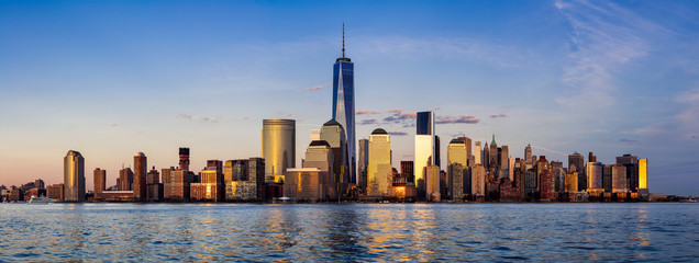 Panoramic of New York City Financial District skyscrapers and Hudson River at sunset. Lower Manhattan - obrazy, fototapety, plakaty