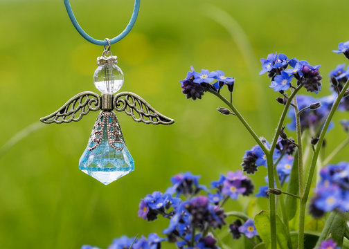 Angel figure and blue flowers