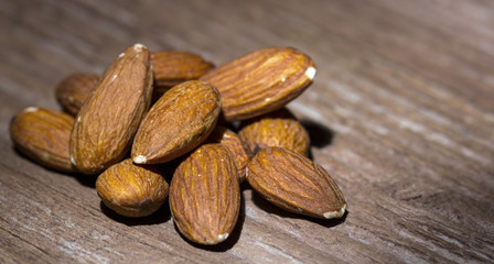 Almonds on wooden background