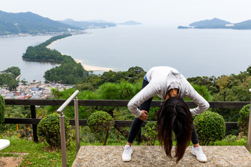 Woman upside down and viewing of Amanohashidate in Kyoto