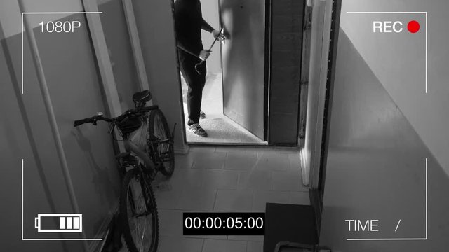 surveillance camera caught the thief broke the door and stole the bike.