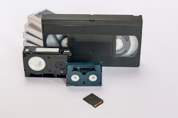 Mini dv and  VHS video tape isolated on white.  SD and MicroSD cards. Cassettes.