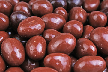 Dark and dairy chocolate balls.  Chocolate drops as background texture pattern. Bon bons.