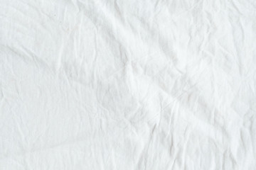 Plakat Wrinkled white cotton fabric texture background, wallpaper