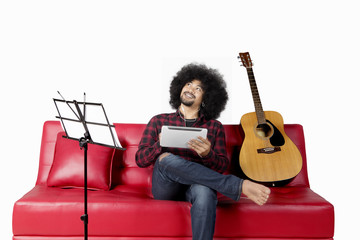 Afro man listening music with earphone