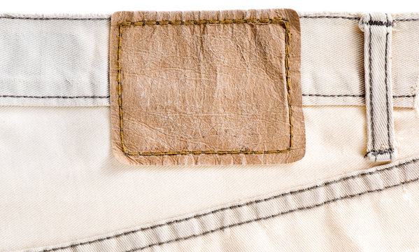 Blank old leather label of brown trousers