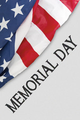 Fototapeta na wymiar American flag near a text of memorial day