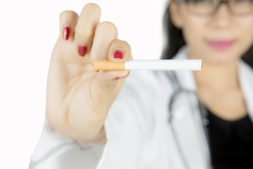 Female doctor hand holding cigarette