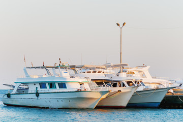 Fototapeta premium Many yachts moored to the pier. Hurgada, Egypt.