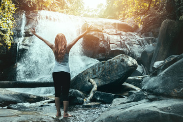woman travelers travel nature Forests, relax play waterfall