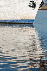 Reflection in the water of a sailboat