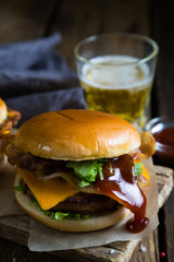 Hamburgers and beer on a wooden table