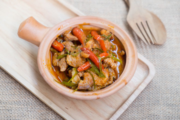 Pork in ground peanut-coconut cream curry
