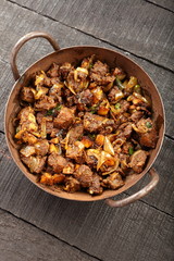 Delicious homemade Mutton roast  served in  cast iron pan-top view.