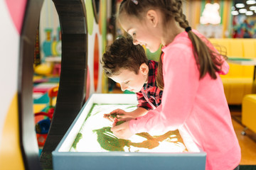 Obraz premium Little kids having fun on attractions
