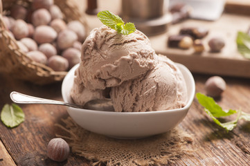 hazelnut ice cream on a wooden background close up